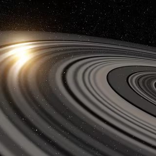 Ces 2 planètes géantes à 1 110 années-lumière sont moins denses que la barbe à papa : les astronomes cherchent l’explication 3 Illustration du vaste système d’anneaux qui entoure la possible super-Saturne ou naine brune J1407b. En passant devant la jeune étoile autour de laquelle elle gravite, la lumière de celle-ci est en partie occultée. © Ron Miller